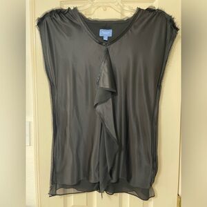 Elegant black satin top with ruffle down the front.